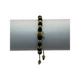 Pulsera tejida neopreno balines y corona con zircones negros dorada